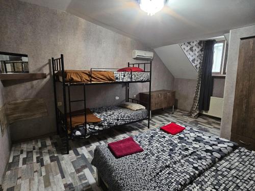 a room with two bunk beds and a bed at Kiev hotel in Tbilisi City
