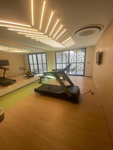 a gym with a treadmill in the middle of a room at Studio Campo Belo 301 in Sao Paulo