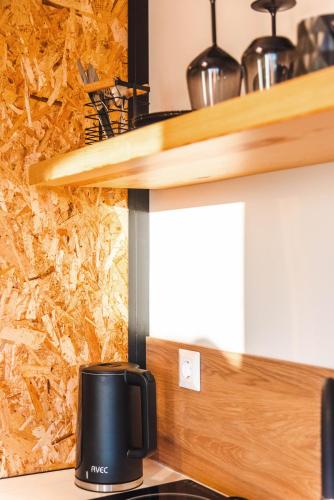 a coffee maker sitting on a counter in a kitchen at Melador beachfront studios in Kavos