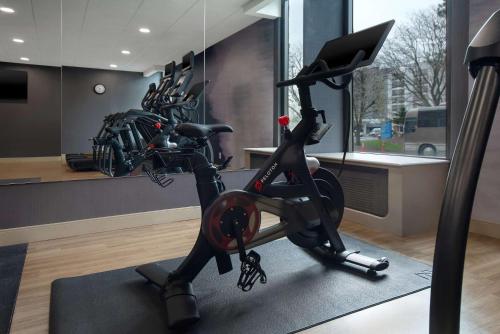 a room with a gym with a bike and a treadmill at Best Western Plus Meadowlands in Secaucus