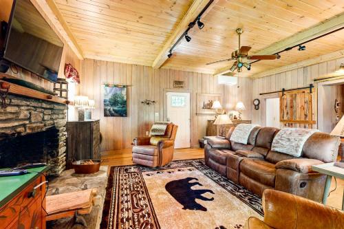 a living room with a couch and a fireplace at Bradley Bear Hideaway in Maggie Valley