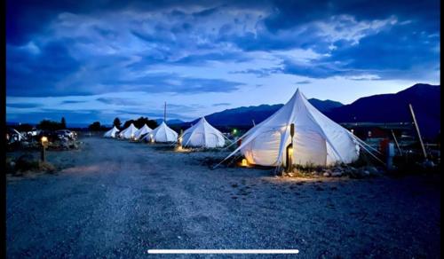 a row of tents sitting in the middle of a road at Arkansas River -P- Glamour Yurt and Breakfast in Buena Vista