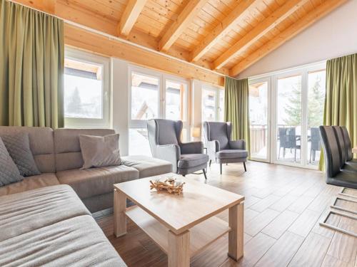 a living room with a couch and a table at Emma Top 3 in Dienten am Hochkönig