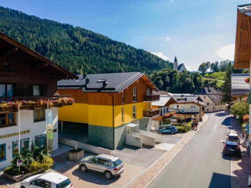 a small town with cars parked on a street at Emma Top 3 in Dienten am Hochkönig