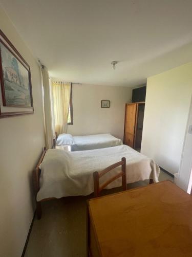 Postel nebo postele na pokoji v ubytování Cabañas Bungalows Calandaima