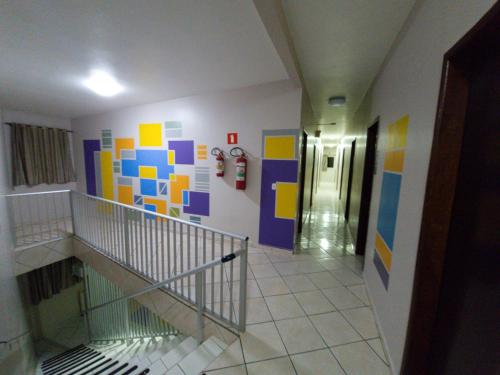 a hallway with colorful tiles on the walls of a building at Dom Pablo Hotéis in São José dos Pinhais