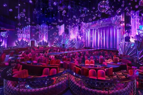 a room filled with red chairs and purple lighting at The Venetian® Resort Las Vegas in Las Vegas
