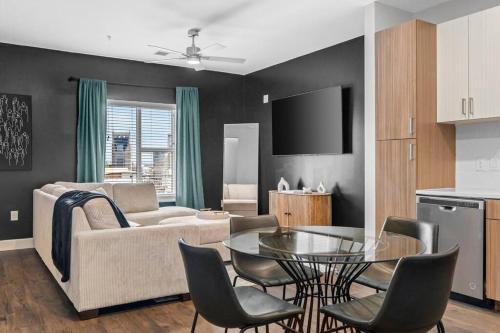 a living room with a couch and a table at The Hollywood Suite The Gulch in Nashville