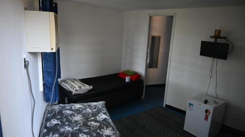 Voodi või voodid majutusasutuse Barra da Tijuca Guest Houses toas