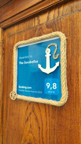 a sign with an anchor on a wooden wall at The Sorabellas in Gaeta