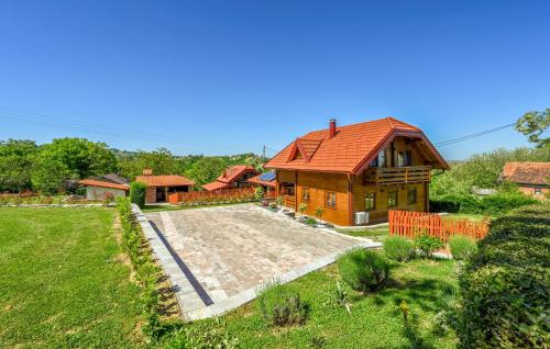 a house with a red roof and a yard at Lovely Home In Vinogradi Ludbreski in Ludbreg