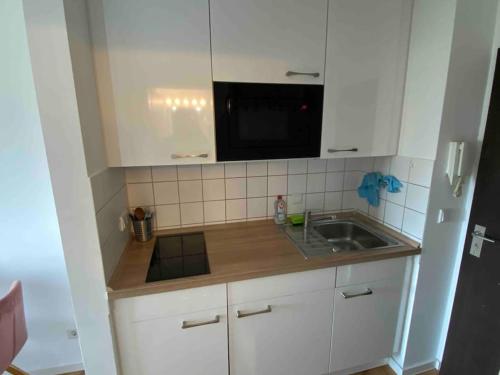 A cozinha ou cozinha compacta de Schöne, kleine, gemütliche Wohnung - Stadtmitte