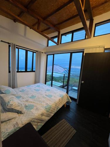 Ένα ή περισσότερα κρεβάτια σε δωμάτιο στο CABAÑA GLAMPING HOUSE