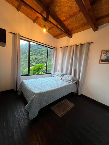 Ένα ή περισσότερα κρεβάτια σε δωμάτιο στο CABAÑA GLAMPING HOUSE
