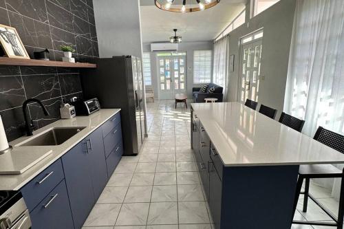 a kitchen with a sink and a counter top at Casa El Coqui in Luyando