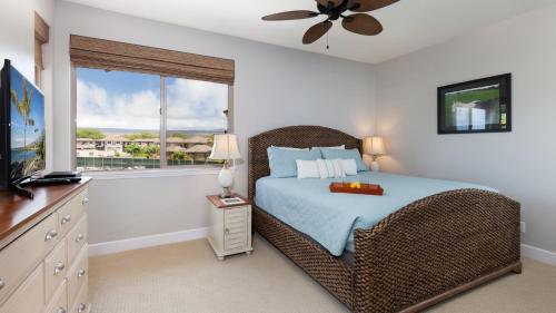 a bedroom with a bed and a window at SEASHELL VILLA Lovely 3BR Kulalani Home with Private Beach Club Bikes in Waikoloa
