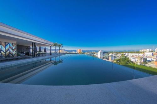 a swimming pool on the roof of a building at Versalles Vista at Roma 240 in Puerto Vallarta