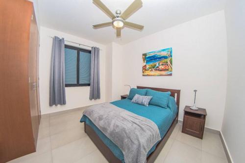 a bedroom with a bed and a ceiling fan at Versalles Vista at Roma 240 in Puerto Vallarta