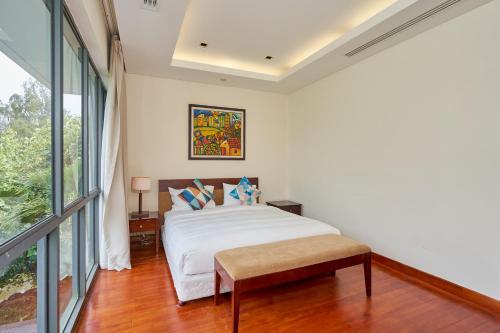 Ένα ή περισσότερα κρεβάτια σε δωμάτιο στο Ocean Sunny Villas Da Nang