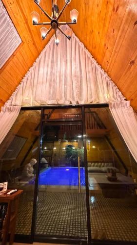 an attic room with a view of a pool at CD NATUREVIEW in Matangtubig