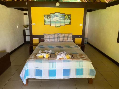 Postel nebo postele na pokoji v ubytování Serenity Bungalows
