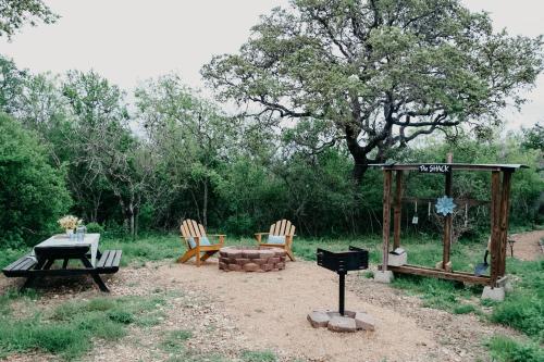 a fire pit with chairs and a table and a grill at Hadley's House - A Country 3 Bdrm with Screened-In Porch in New Braunfels