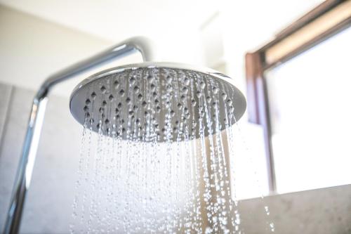 a shower head with water dripping from it at Nightcap at Dalrymple Hotel in Townsville