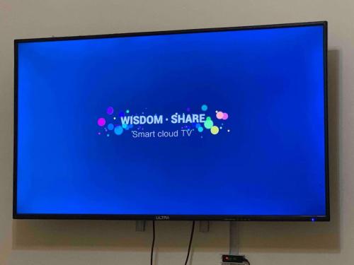 a computer monitor with a blue screen with bubbles on it at Poolside serenity in El Alamein