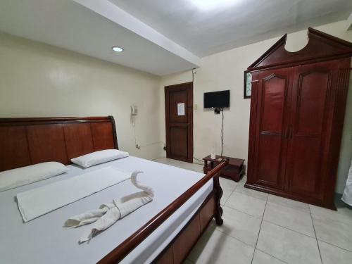 Katil atau katil-katil dalam bilik di Goland Pension House & Dormitory by SMS Hospitality