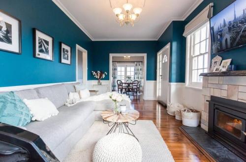 a living room with a couch and a fireplace at Byrne House - 3BR Rustic Luxe - Wi-Fi in Mount Gambier