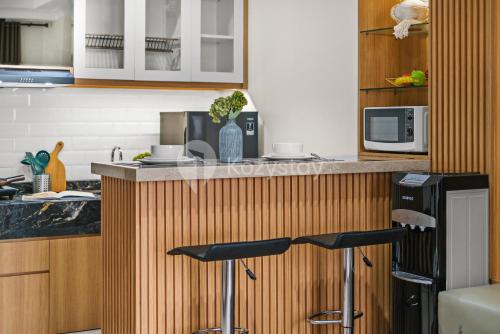Una cocina o zona de cocina en Tilia By Kozystay - Permata Hijau