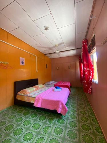 a bedroom with two beds in a room at B'first Chalet Perhentian Island in Kuala Besut