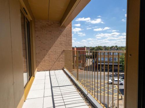 a balcony with a view of a building at Modern Apartments with Balcony in Merton near Wimbledon by Sojo Stay in Mitcham