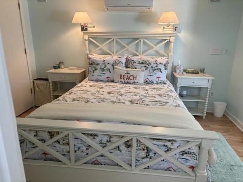 a bedroom with a large bed with two night stands at Oceanfront Adorable Cottage! Perfect For A Couple Or Small Family Of 4! in Ship Bottom