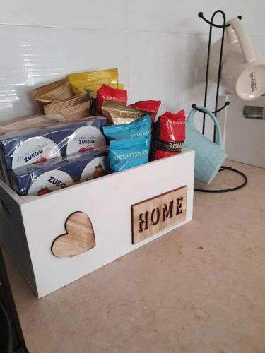 a white box with a heart and a home sign at Sulla via del Mare Room I.U.N R5045 in Terralba