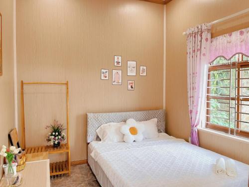 Llit o llits en una habitació de Pra-Ha Villa