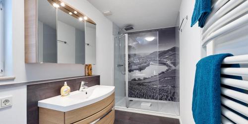 a bathroom with a sink and a shower at Sonnenuhr in Bernkastel-Kues