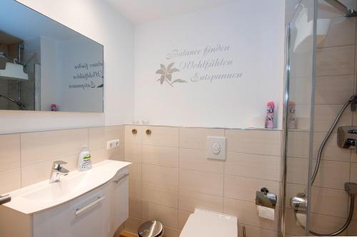 a bathroom with a toilet and a sink and a shower at Studio Apartment am historischen Matthiasturm in Neef