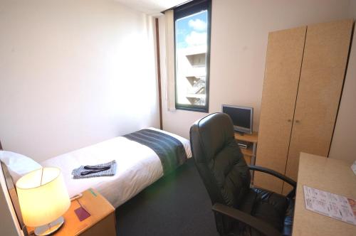 Postel nebo postele na pokoji v ubytování ArC LIFESTYLE SPACE & HOTEL