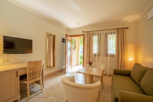 a living room with a couch and a table at Dalyan Resort - Special Category in Dalyan