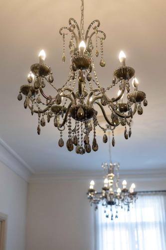 a chandelier hanging from a ceiling in a room at Limassol Old Town Mansion in Limassol