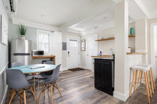 a kitchen and dining room with a table and chairs at Modern Duplex Downtown AC Walkable in Traverse City