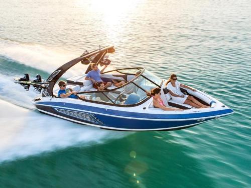a group of people riding in a boat on the water at Modern Duplex Downtown AC Walkable in Traverse City