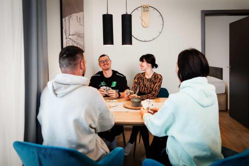a group of people sitting around a table at TRI VODY Demänovská Dolina in Liptovský Mikuláš