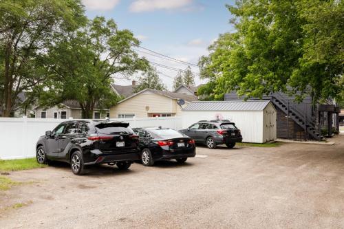 a group of three cars parked in a driveway at Juniper at Timberline Flats in Traverse City