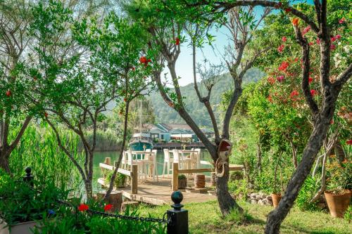 a view of a wooden deck with a table and chairs at Dalyan Resort - Special Category in Dalyan