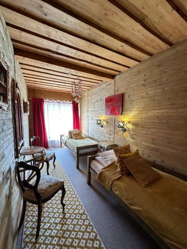 a room with a bed and a couch in a room at Rakši in Cēsis