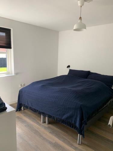 Postel nebo postele na pokoji v ubytování Hus i Løkken