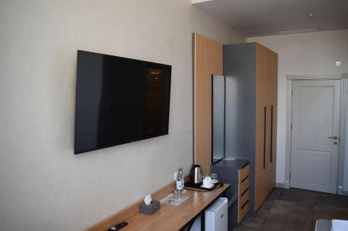 TV a/nebo společenská místnost v ubytování Prime Hotel