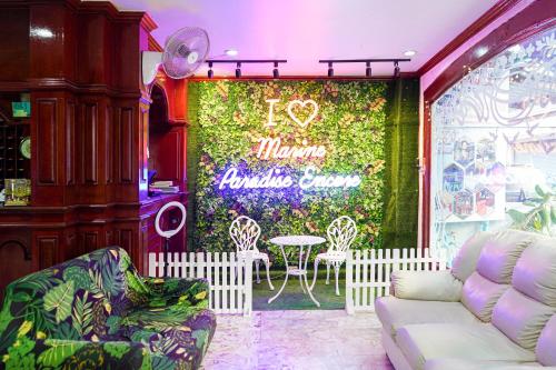 a window of a restaurant with a table and chairs at Marine paradise Encore in Pattaya South